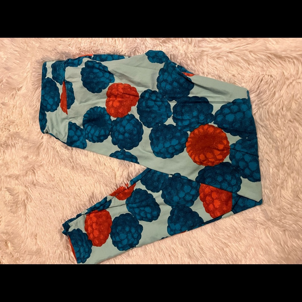 Lularoe Leggings with raspberries and blueberries on a blue background